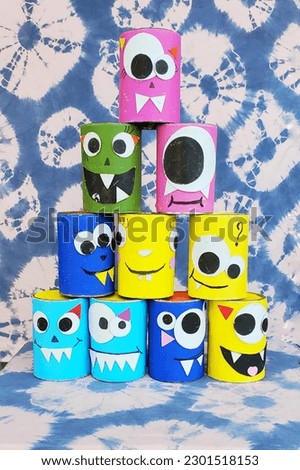 Bangkok, Thailand - February, 2023: Tin can toss game, with tin can decorated with funny faces, in a carnival Royalty-Free Stock Photo #2301518153