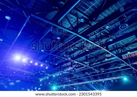 View of air conditioning system and roof lighting of large event venue. Royalty-Free Stock Photo #2301543395