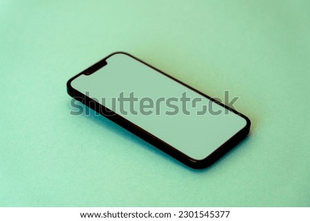Mobile phone device mockup. Green background. Isometric view Royalty-Free Stock Photo #2301545377