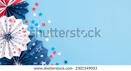 4th of July, USA Presidents Day, Independence Day, Memorial day, US election concept. Red white and blue paper fans with stars confetti on blue background. Flat lay, top view, copy space, banner