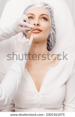 Lip Augmentation. Woman Getting Beauty Injection For Lips Royalty-Free Stock Photo #2301561075