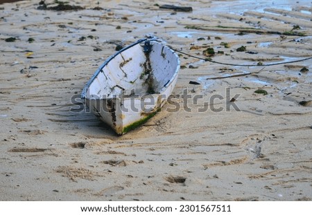 The Paddle boat, on the coastline when the sea water recedes Royalty-Free Stock Photo #2301567511