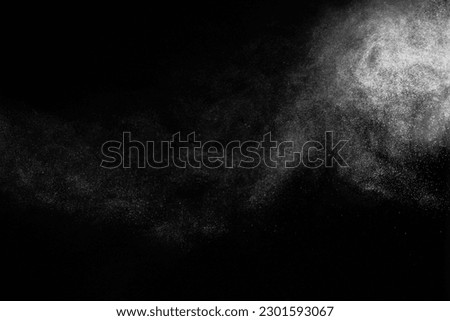 Natural dust particles flow in air on black background Royalty-Free Stock Photo #2301593067