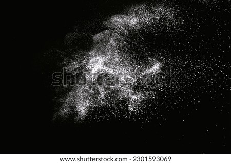 Natural dust particles flow in air on black background Royalty-Free Stock Photo #2301593069