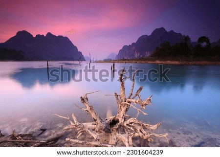 Klong Ka Raft House,the
beautiful scenery especially during the sunrise and sunset. The front of the raft is a wide inlet, reflecting its shadow like a mirror.
KHAO SOK NATIONAL PARK ,Thailand  Royalty-Free Stock Photo #2301604239