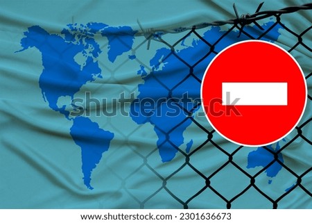 world map on satin, fence with barbed wire, symbolic red sign no entry, entry is prohibited, travel restrictions across European Union border, emigration problems, concept tourism, economics, politics