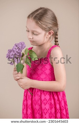 Blond Kid Girl Holding Flowers
