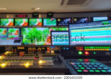 Blur images of multiple Television Broadcast. in Master control room.