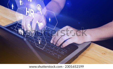 Businessman hand pressing human resources button, Human resources, HR management, employment, headhunting concept, hand holding modern social buttons on virtual background