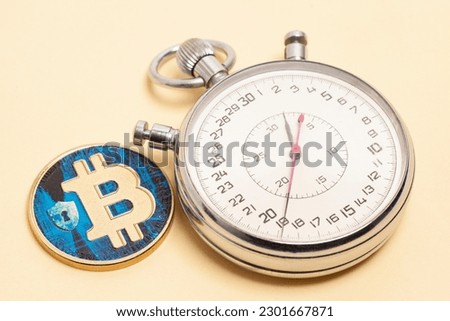 Stopwatch and bitcoin. Fast money on bitcoin. Fast cryptocurrency transfer.