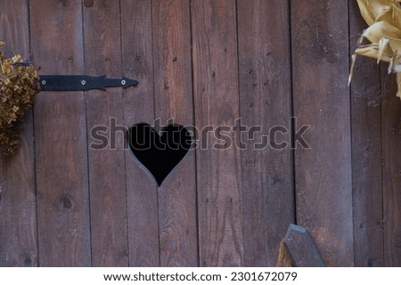 heart shape on a wooden door, WC sign
