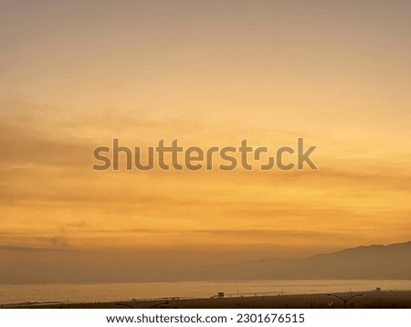 Sept. 6th 2022 -  Santa Monica, California, USA - The sunset at Santa Monica beach as seen from the California Incline on the Pacific Palisade in Los Angeles Royalty-Free Stock Photo #2301676515
