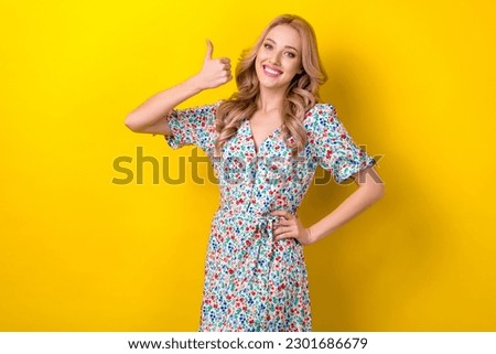 Photo of glad cheerful stunning lady wear stylish quality clothes thumb up satisfied nice choice isolated on yellow color background