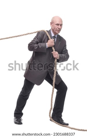 business man pulls a rope. isolated on a white Royalty-Free Stock Photo #2301688337