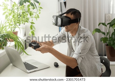 Man wearing virtual reality goggles. Studio shot