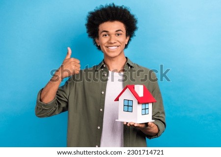 Photo of young owner bought personal house office thumb up recommend realtor guy student credit mortgage isolated on blue color background