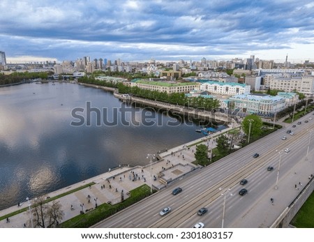 Embankment of the central pond and Plotinka. The historic center of the city of Yekaterinburg, Russia, Sunset in the early spring. Aerial View