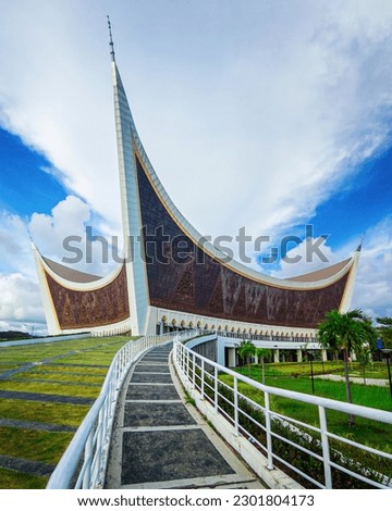 a mosque with a unique architecture.  with gabled roofs in every corner.  West Sumatra Grand Mosque, Padang, Indonesia Royalty-Free Stock Photo #2301804173