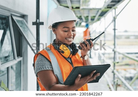 Tablet, engineer and black woman worker planning on a construction site strategy and talking on a walkie talkie. Project management, infrastructure and female contractor doing building assessment