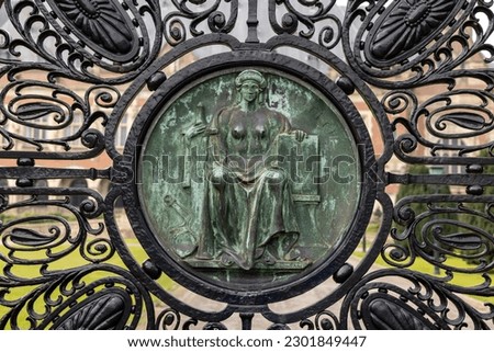  Figure of Justice (Justitia) on the black wrought iron gates of the Peace Palace in The Hague, which houses the International Court of Justice Royalty-Free Stock Photo #2301849447