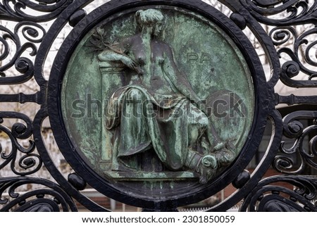  Figure of Peace (Pax) on the black wrought iron gates of the Peace Palace in The Hague, which houses the International Court of Justice Royalty-Free Stock Photo #2301850059
