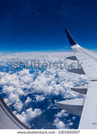 beautiful view of the clouds against the background of the blue sky, photo taken from an airplane.
