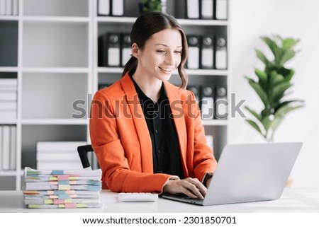 business woman working at office with laptop and documents on his desk, financial adviser analyzing data.