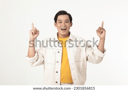 Portrait of a young Asian handsome adult male student, excited and show the expression with hand gesture.