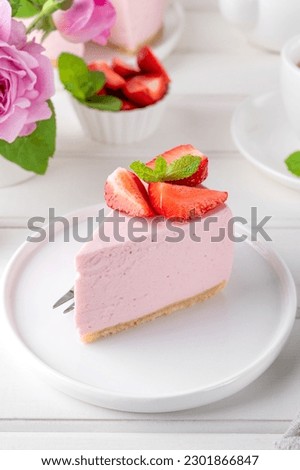 No bake cheesecake with fresh strawberries on a white wooden background. Summer dessert. Selective focus. Copy space Royalty-Free Stock Photo #2301866847