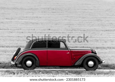Retro style photo of a classic oldtimer vintage car of the 1930s - 1940s. Royalty-Free Stock Photo #2301885173