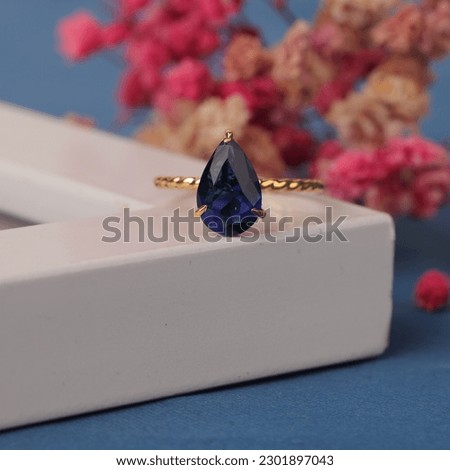 Wedding ring set on white Frame. The jewelry ring is ready to be showcased and sold. The wedding ring is a sign of the love of the couple. Stone and diamonds complete the ring's beauty. focus blur.