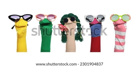 Many colorful sock puppets on white background, collage design Royalty-Free Stock Photo #2301904837