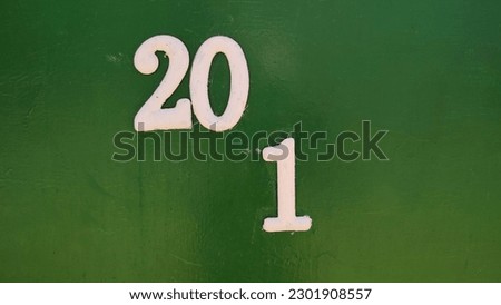 numbers white numbers 20 and 1 on a green background, house, apartment, symbol, designations conditional places. High quality photo