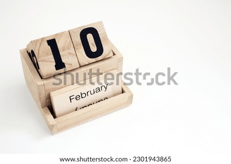 Wooden perpetual calendar showing the 10th of February