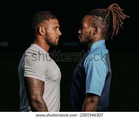 Profile, rival and a sports black man facing his opponent while looking serious in studio on a dark background. Face, challenge or conflict with a male athlete and competitor ready for competition Royalty-Free Stock Photo #2301946307
