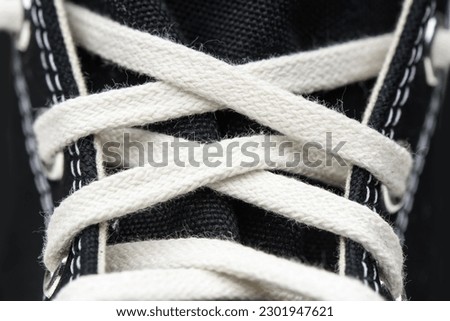 Laced sneakers close up photo
