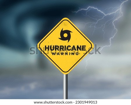 Hurricane warning sign against a powerful stormy background with copy space. Dirty and angled sign with cyclonic winds add to the drama. Royalty-Free Stock Photo #2301949013