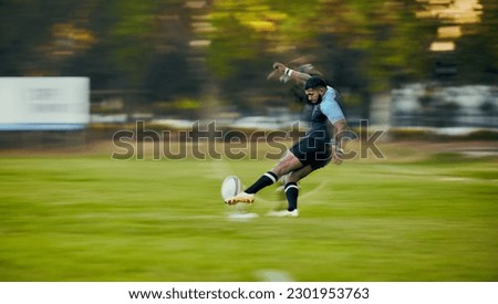 Rugby, action and black man kicking ball to score goal on field at game, match or practice workout. Sports, fitness and motion, player running to kick at poles on grass with energy and skill in sport Royalty-Free Stock Photo #2301953763