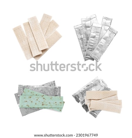 Set with sticks of chewing gum on white background, top view