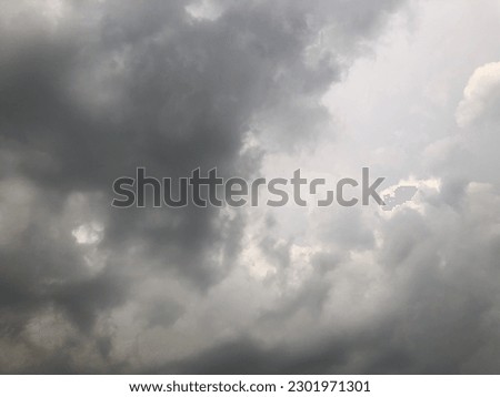 Dusk overcast sky view it guess the rain is coming. Gloomy sky. Dark cloudy sky atmosphere in summer season. Royalty-Free Stock Photo #2301971301