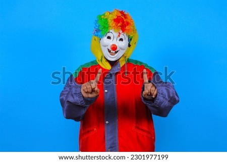 colorful clown poses on blue background