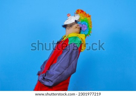 colorful clown poses on blue background