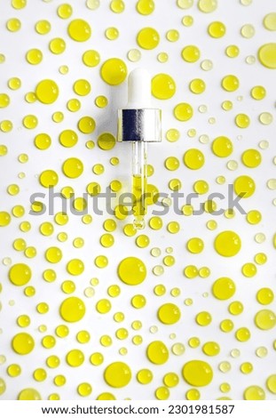 Drops of oil pipette isolate on white background. Selective focus. Nature.