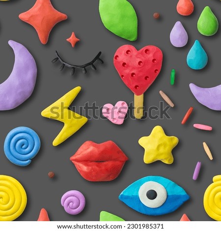 Seamless bright pattern on gray background. Handmade eyes, lips, moon, stars, drops, lightning, hearts from modeling clay.