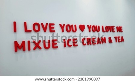 Purwokerto, Indonesia - April 2023 : Wall decoration at the mixue outlet. Words of love or quotes from mixue ice cream and tea. Words on the wall "i love you, you love me
