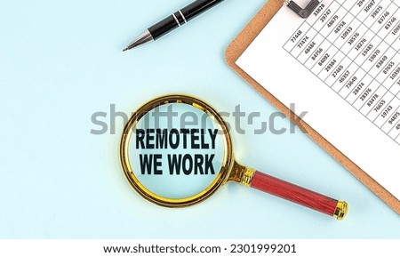 REMOTELY WE WORK text on a magnifier with clipboard on blue background