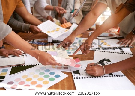 Color design, creative and hands of business people on desk for branding meeting, strategy and marketing logo. Teamwork, collaboration and designers brainstorming ideas, thinking and project plan