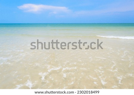 Landscape view of beach and sea in sunny day. Tropical sea and blue sky