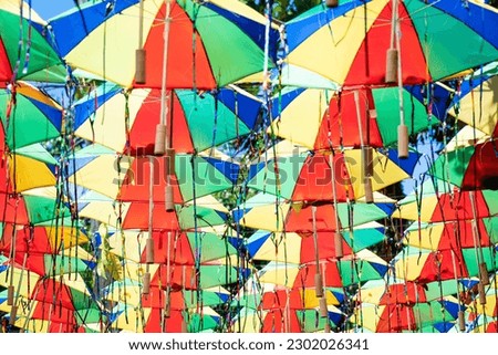 Carnival street decoration made with lots of little colorful umbrellas hanging on strings in Olinda, Pernambuco, Brazil.