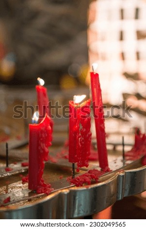 red candles placed in chinese temples for incense